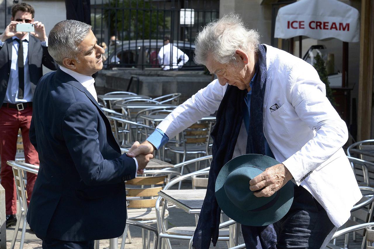 Actor Ian McKellen greets the newly elected Mayor of London Sadiq Khan (L) ahead of his signing ceremony at Southwark Cathedral, central London, Britain May 7, 2016. REUTERS/John Stillwell/Pool