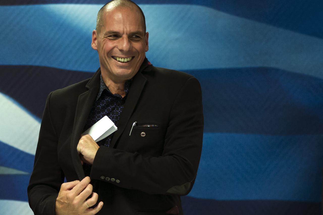 Newly appointed Greek finance minister Yanis Varoufakis smiles after hand over ceremony in Athens, January 28, 2015. Greece's finance minister on Wednesday said he plans to meet European counterparts to find a deal between the country and its creditors to