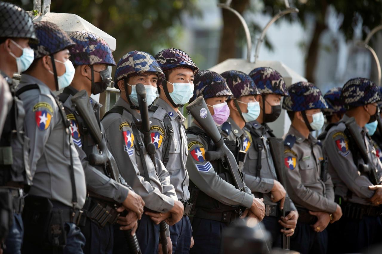 Police stan guard as they wait for protests against coup in Yangon