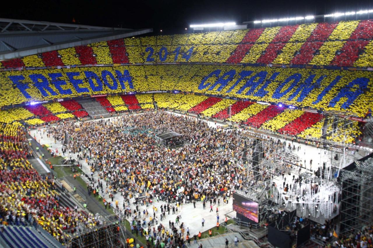 'The crowd is seen during the Concert for Freedom event at Nou Camp stadium, where artists will sing in support of Catalonia's desire for independence from Spain, in Barcelona June 29, 2013. REUTERS/