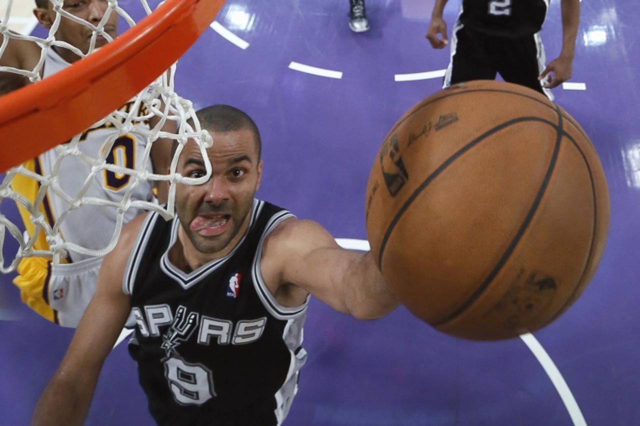 'San Antonio Spurs Tony Parker (R) goes up to score against Los Angeles Lakers Andrew Goudelock during Game 4 of their NBA Western Conference Quarterfinals basketball playoff series in Los Angeles, Ap