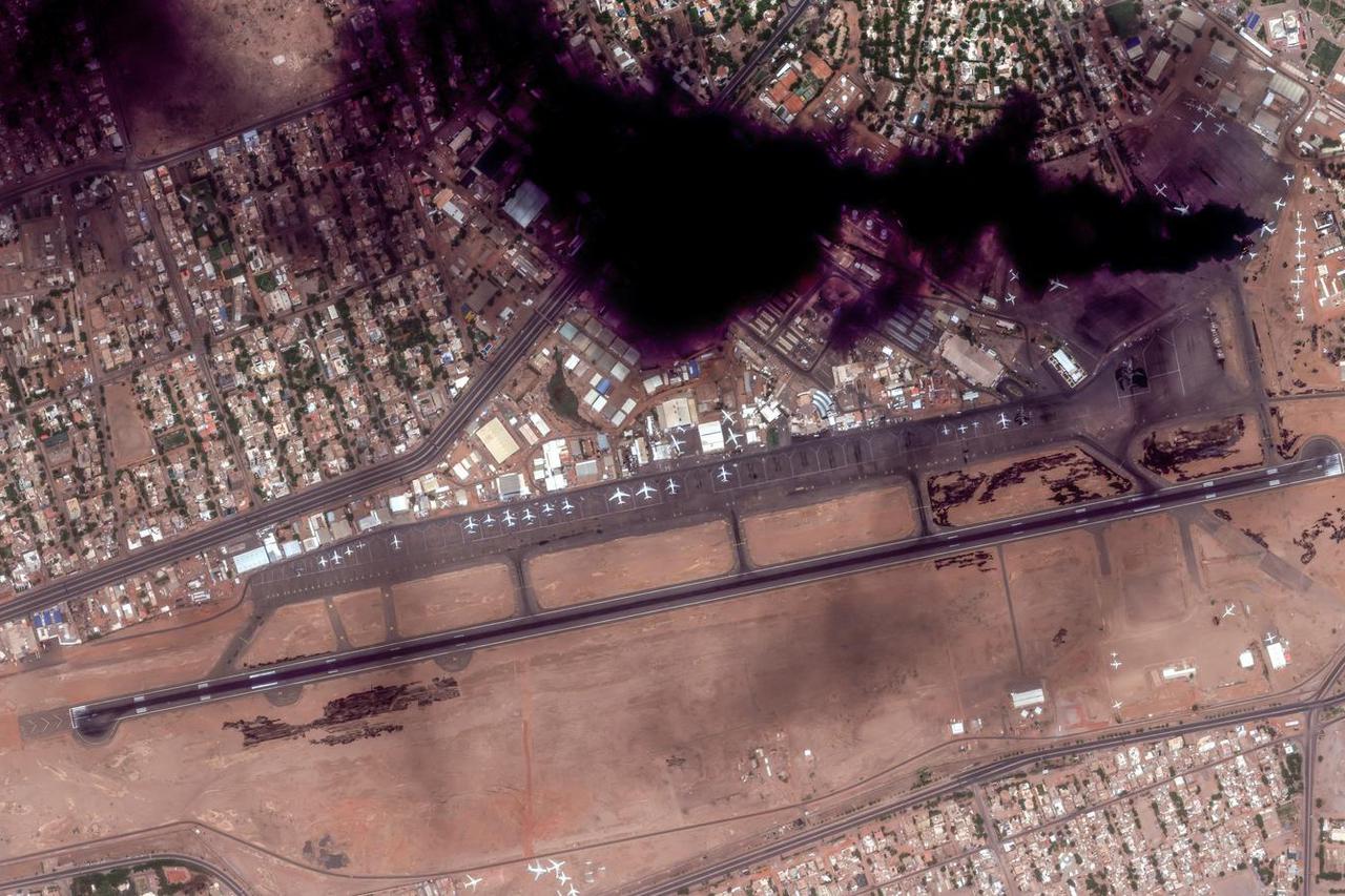 Satellite image shows smoke and an overview of Khartoum International Airport in Khartoum