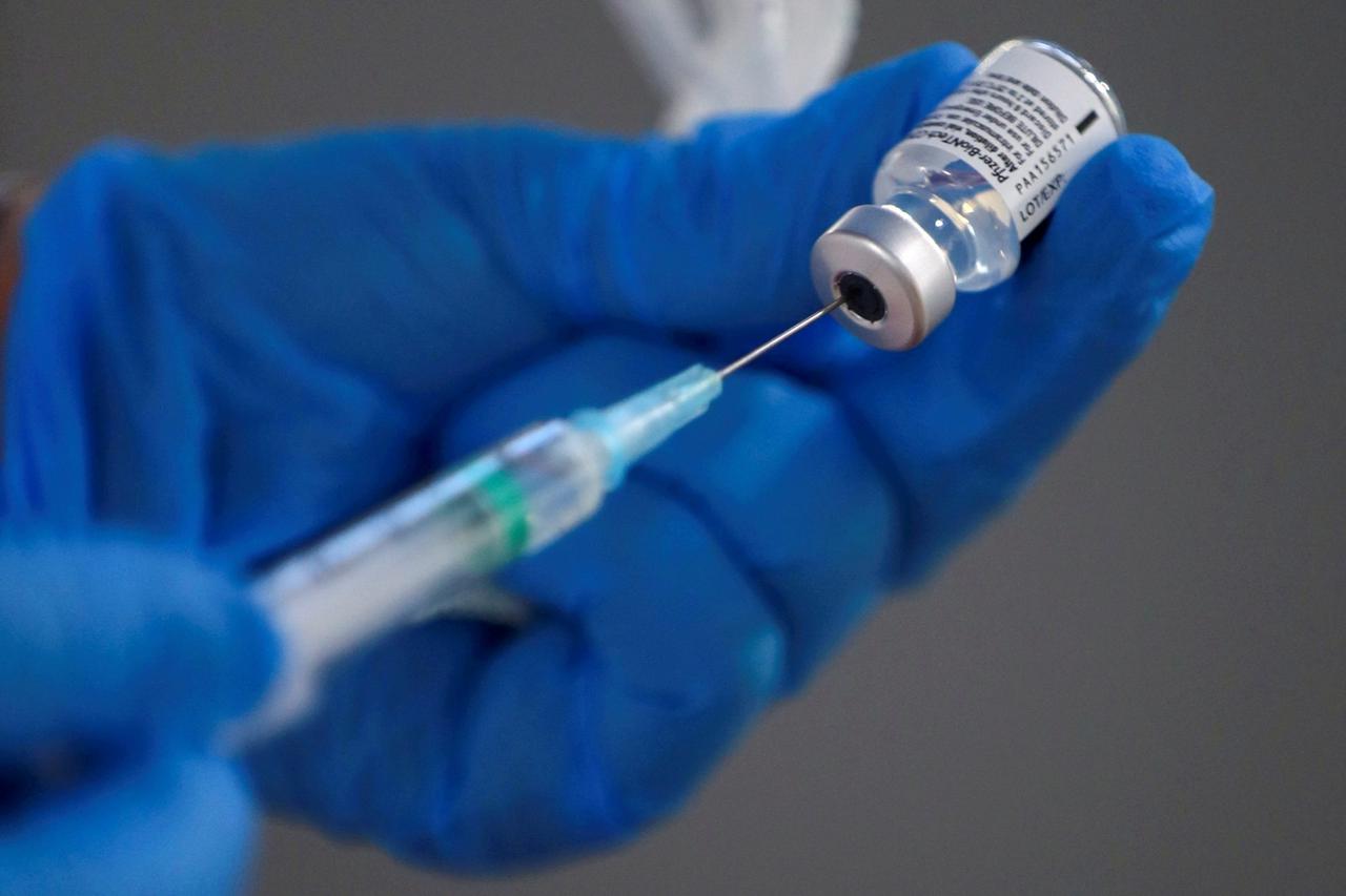 FILE PHOTO: A nurse fills a syringe with a second dose of the Pfizer-BioNTech COVID-19 vaccine in Madrid