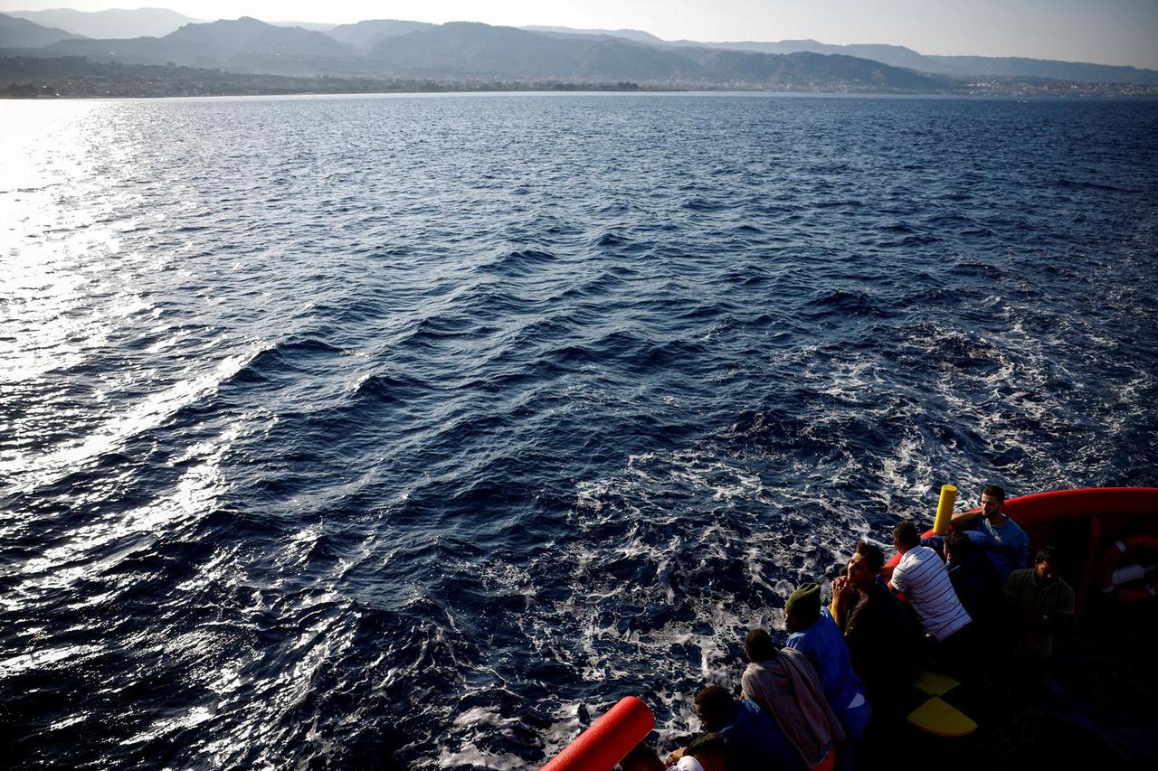 FILE PHOTO: Migrants on board Open Arms rescue boat arrive at Messina port