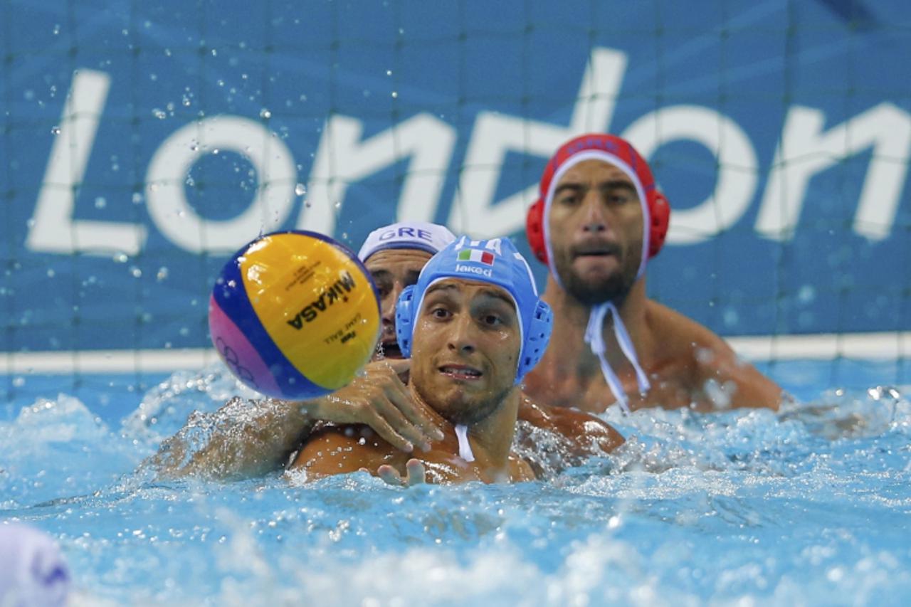 'Greece\'s Evagelos Delakas (L) challenges Italy\'s Deni Fiorentini (C) during their men\'s preliminary round Group A water polo match at the Water Polo Arena during the London 2012 Olympic Games July