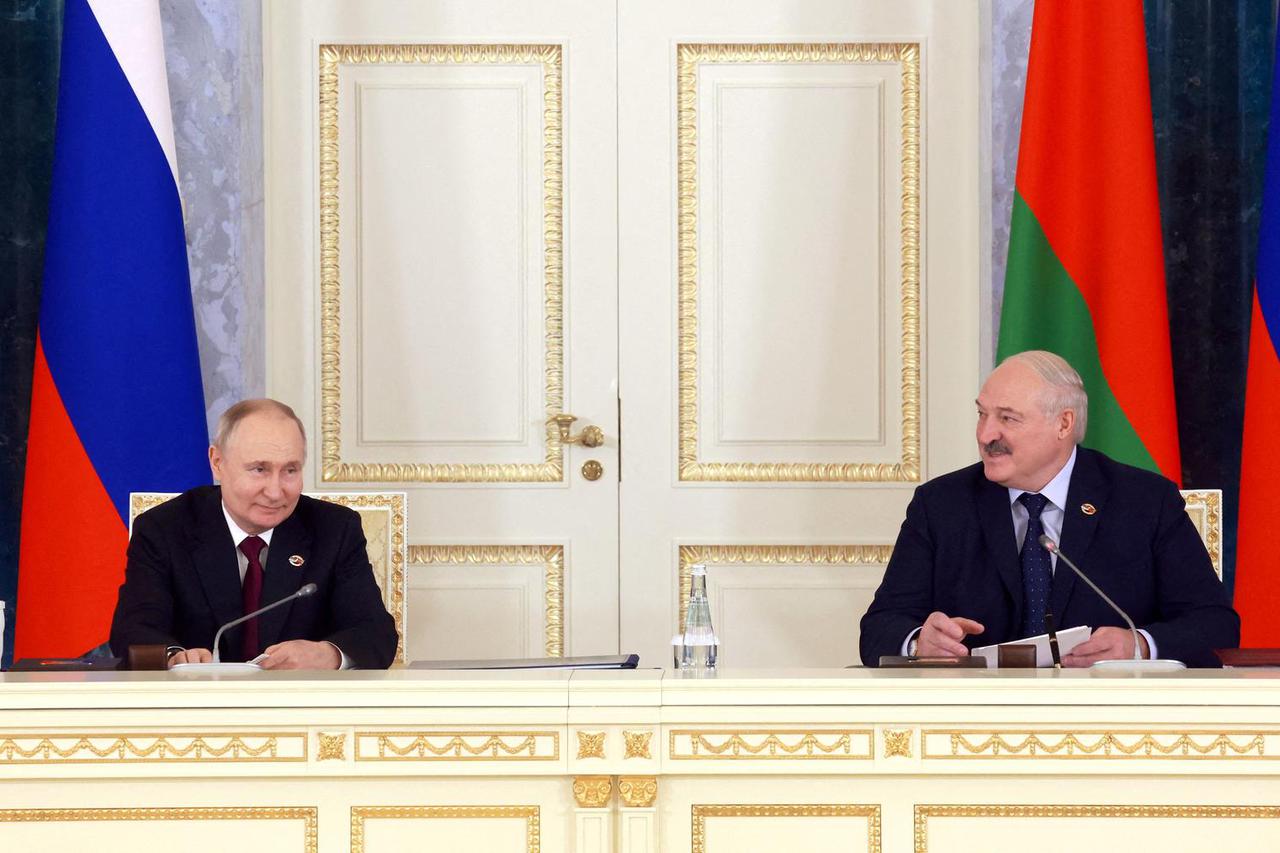 FILE PHOTO: Russian President Putin and Belarusian President Lukashenko chair Union State's Council meeting in St Petersburg