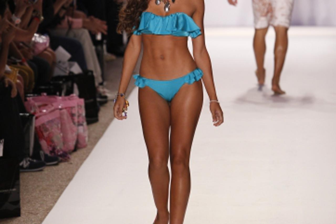 'Models wear a Nicolita swim suit during the Mercedes-Benz Fashion Week in Miami Beach, Fla. Monday, July 18, 2011. (AP Photo/J Pat Carter)Photo: Press Association/PIXSELL'