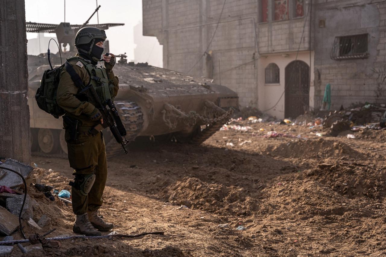 An Israeli soldier takes part in a ground operation in Gaza