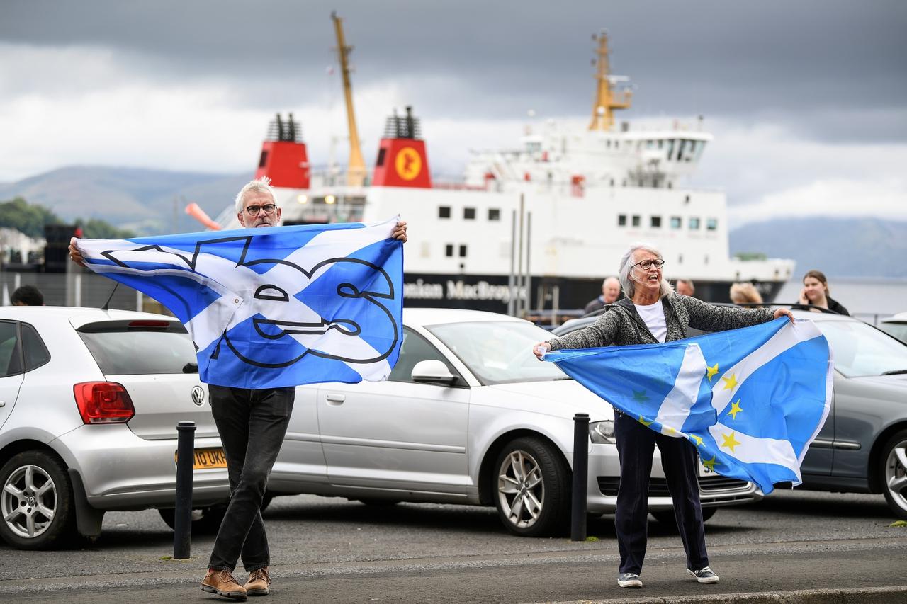 Nationalist demonstrators welcome Britain's Chancellor of the Exchequer Rishi Sunak in Rothesay