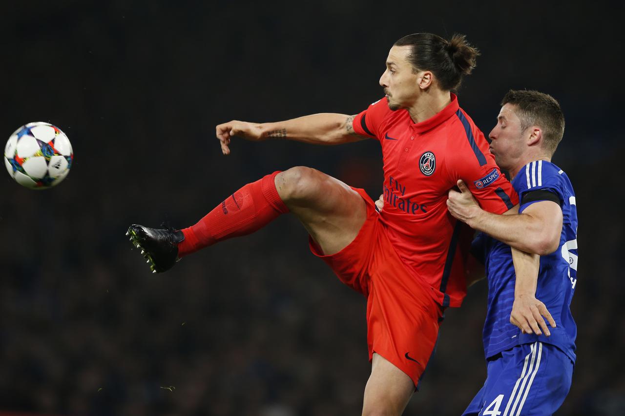 Football - Chelsea v Paris St Germain - UEFA Champions League Second Round Second Leg - Stamford Bridge, London, England - 11/3/15 PSG's Zlatan Ibrahimovic in action with Chelsea's Gary Cahill Action Images via Reuters / John Sibley Livepic EDITORIAL USE 