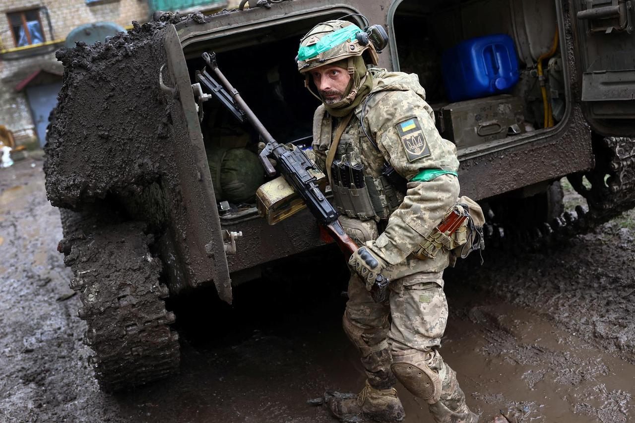 Ukrainian servicemen return from heavy fighting near Bakhmut