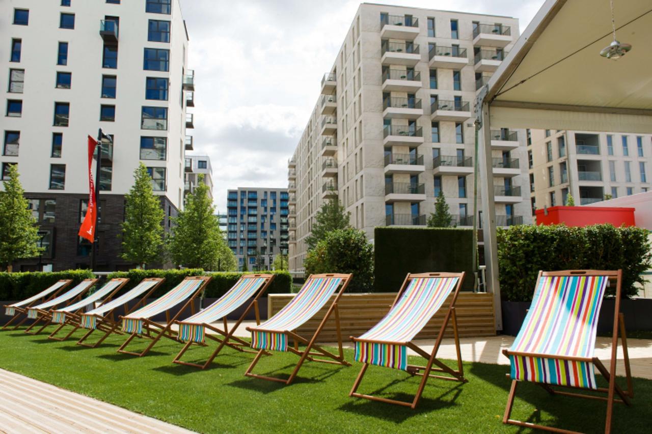 'Deckchairs are lined up outside one of the social areas inside the London 2012 Olympic Athletes Village in the Olympic Park in east London, on July 12, 2012. The 2012 Olympic games will begin on July