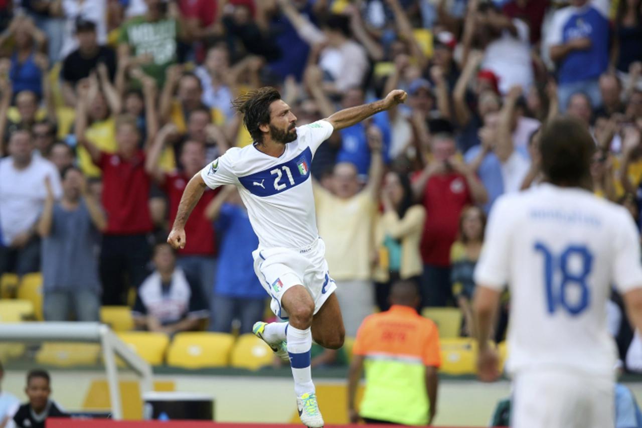 'Italy\'s Andrea Pirlo celebrates after scoring a free kick goal against Mexico during their Confederations Cup Group A soccer match at the Estadio Maracana in Rio de Janeiro June 16, 2013.  REUTERS/S