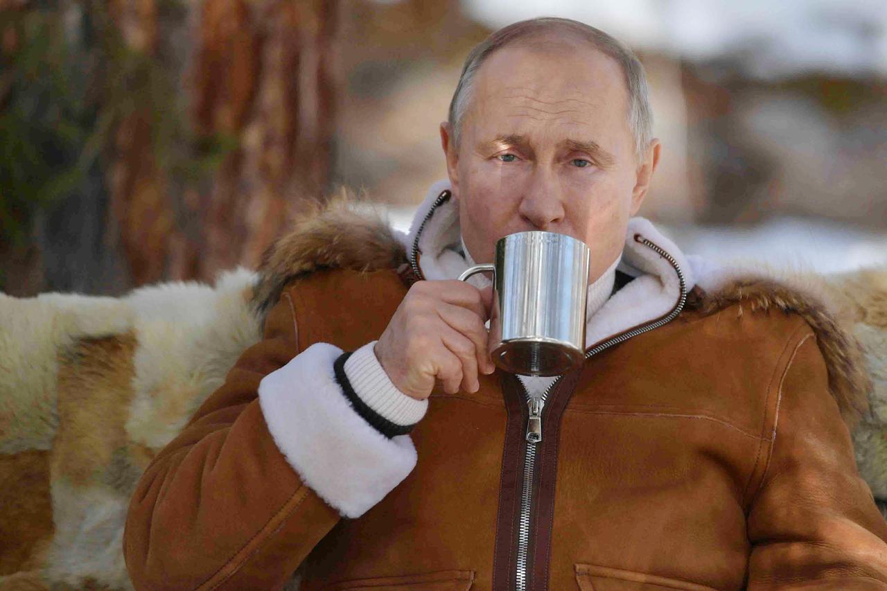 Russian President Putin and Defense Minister Shoigu take break in Siberia