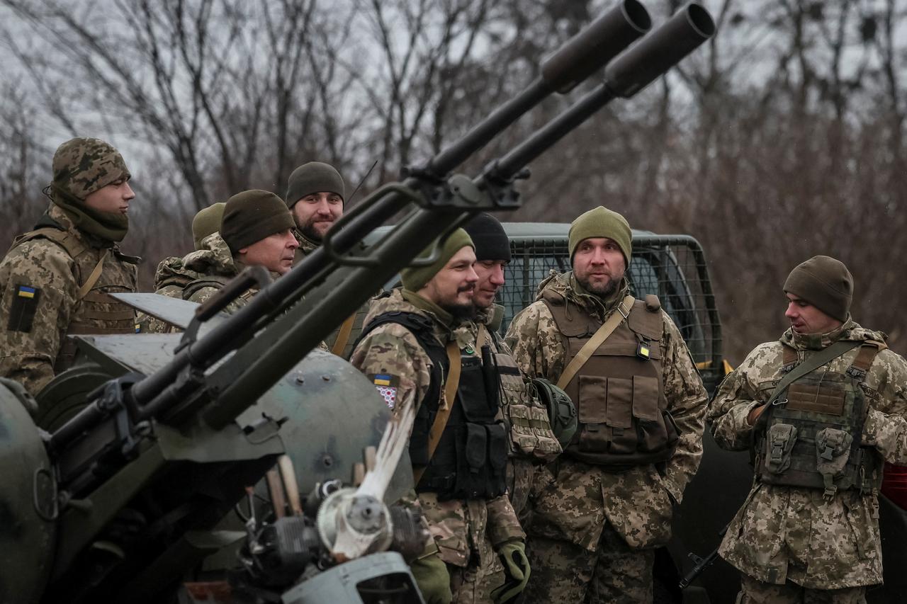 Ukrainian servicemen from air defence units prepare for an award ceremony after repelling the second biggest Russian missile and drone attack in five days, near Kyiv