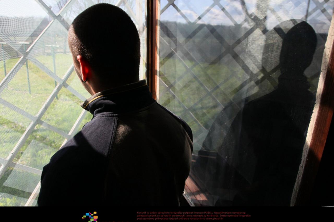 '10.03.2009., Turopolje - Sticenik gleda kroz prozor Odgojnog zavoda Turopolje, maloljetnickog zatvora.  Photo: Jurica Galoic/24sata'