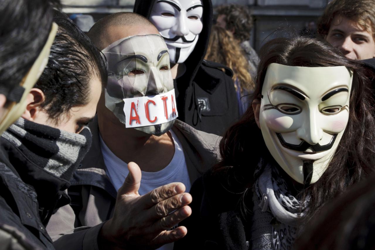 'Protesters wearing Anonymous Guy Fawkes masks take part in a demonstration against controversial Anti-Counterfeiting Trade Agreement (ACTA), on March 10, 2012 in Lyon, central-eastern France. AFP PHO