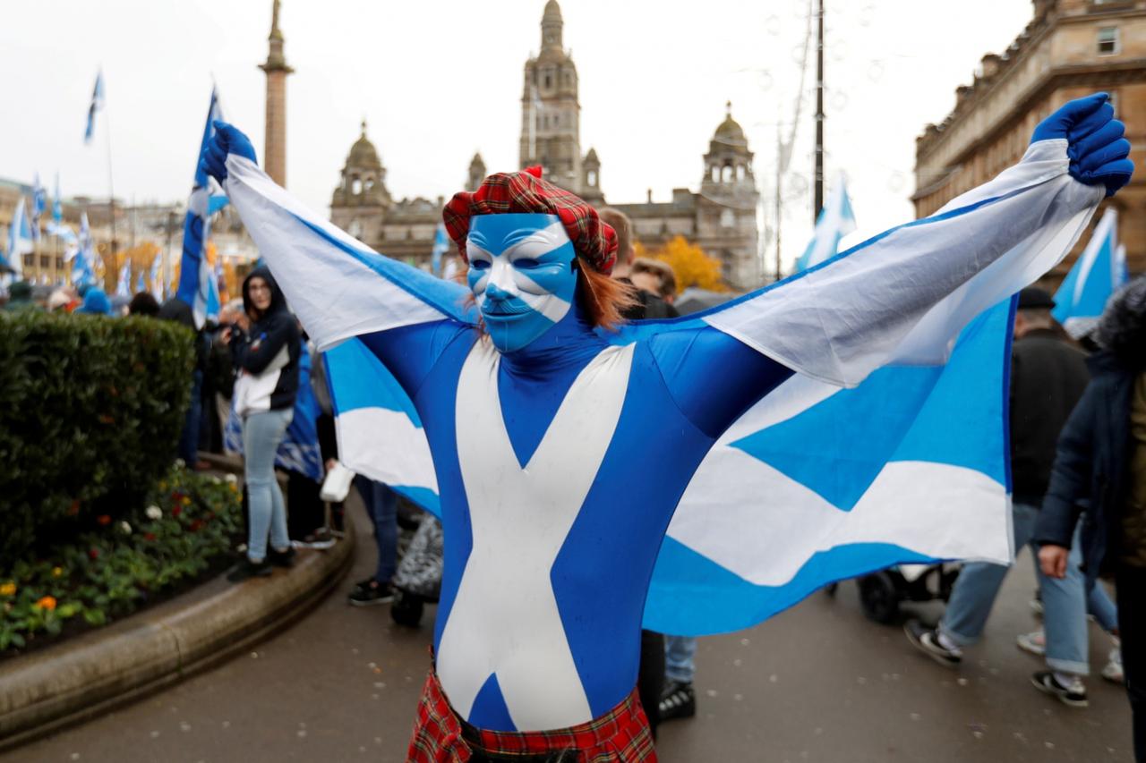 FILE PHOTO: A demonstrator holds a flag during a pro-Scottish Independence rally in Glasgow, Scotland, November 2