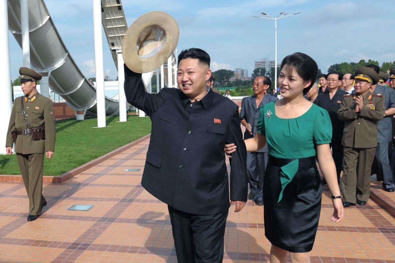 'North Korean leader Kim Jong-Un and his wife Ri Sol-Ju attend the opening ceremony of the Rungna People\'s Pleasure Ground on Rungna Islet along the Taedong River in Pyongyang in this July 25, 2012 p