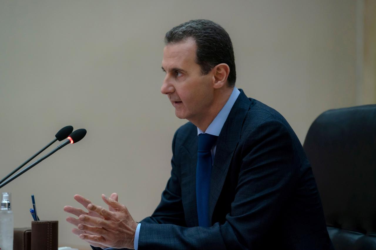 Syrian President Bashar al-Assad addresses the government committee that oversees measures to curb the spread of the coronavirus disease (COVID-19), in Damascus