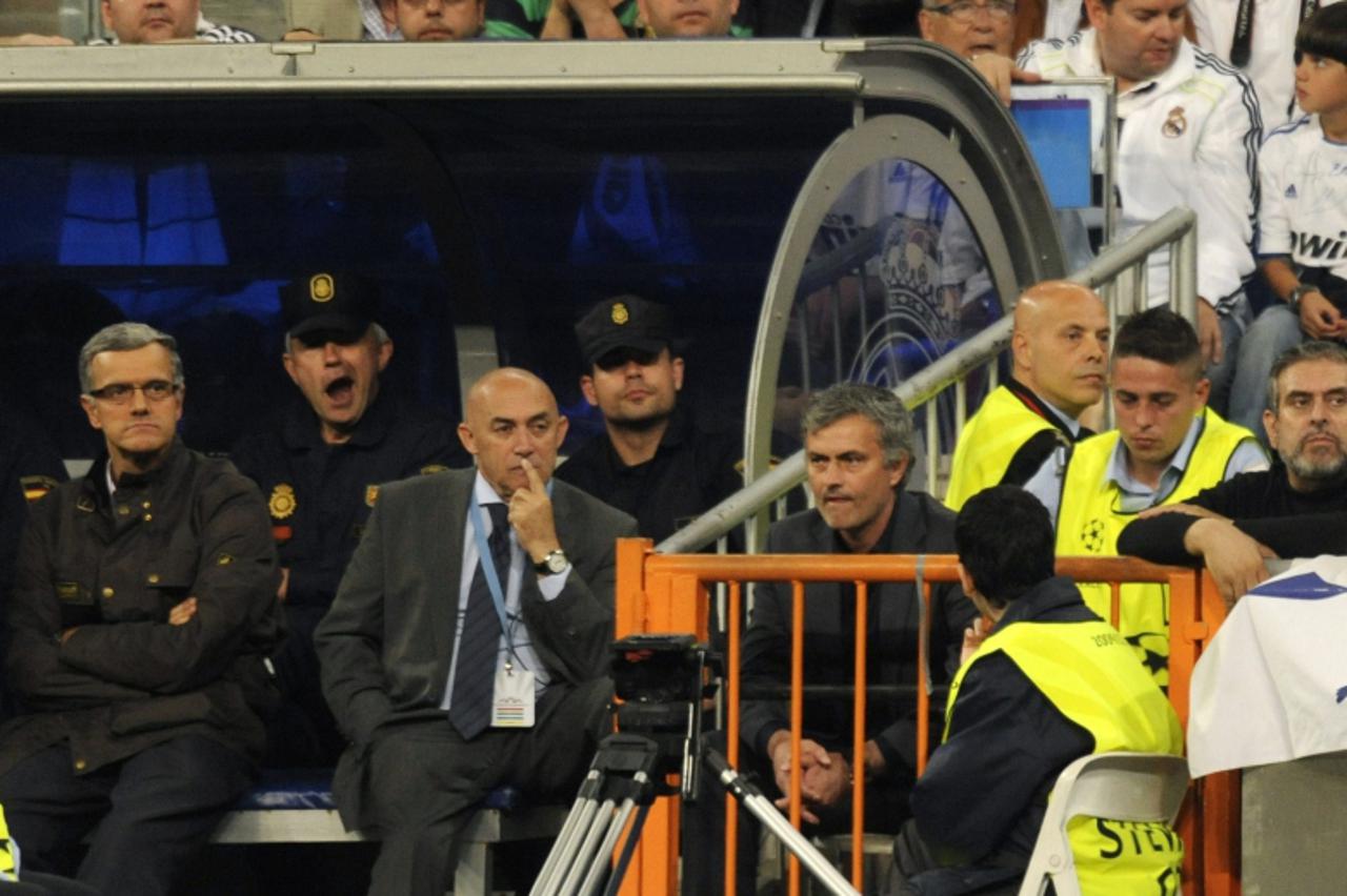 \'Real Madrid\'s Portuguese coach Jose Mourinho (3R) is pictured after being expeled from the field during the Champions League semi-final first leg football match between Real Madrid and Barcelona at