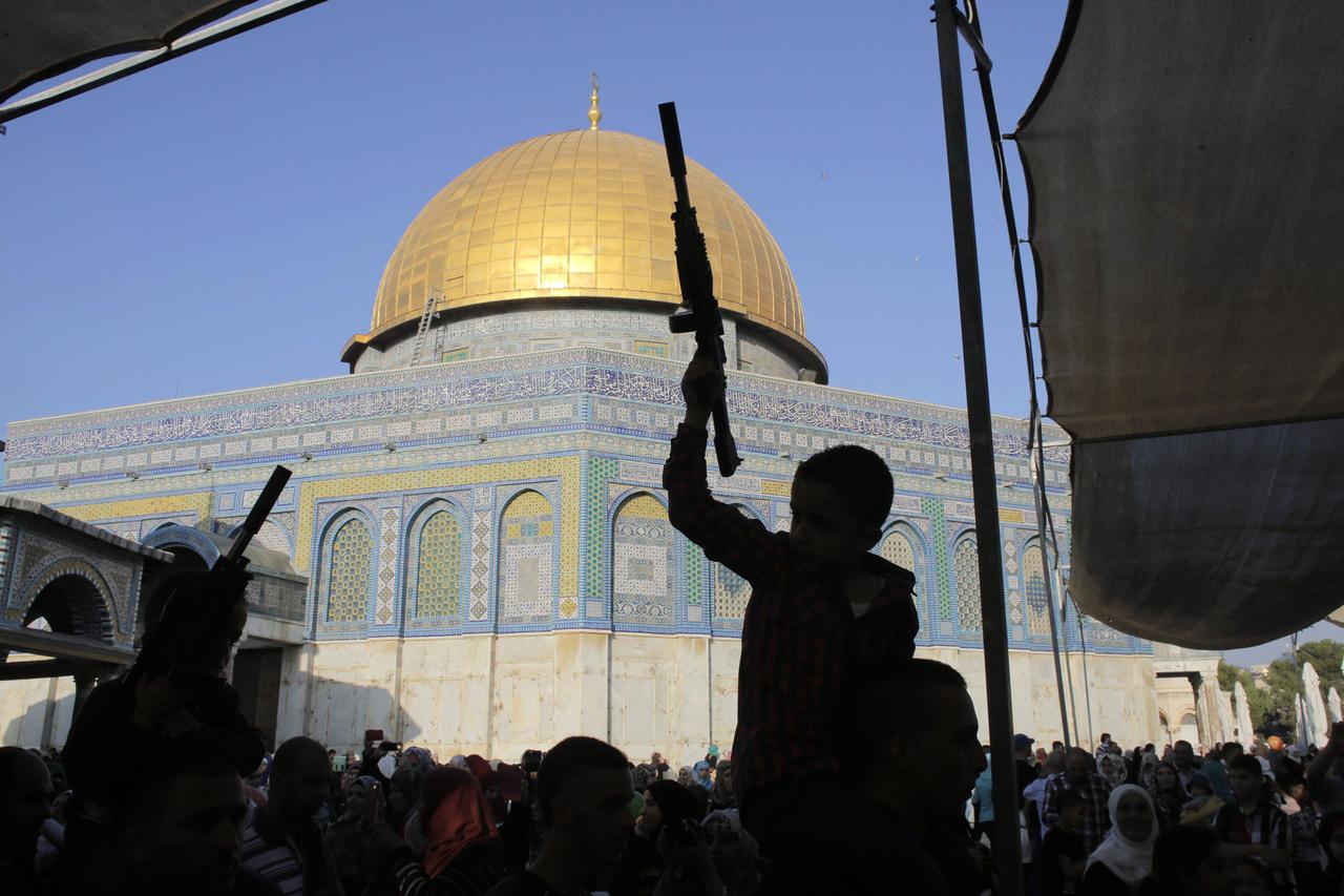 Palestinian children hold toy guns in front of the Dome of the Rock during a protest on the compound known to Muslims as al-Haram al-Sharif and to Jews as Temple Mount in Jerusalem's Old City, against Israel's military offensive in Gaza July 28, 2014. Isr