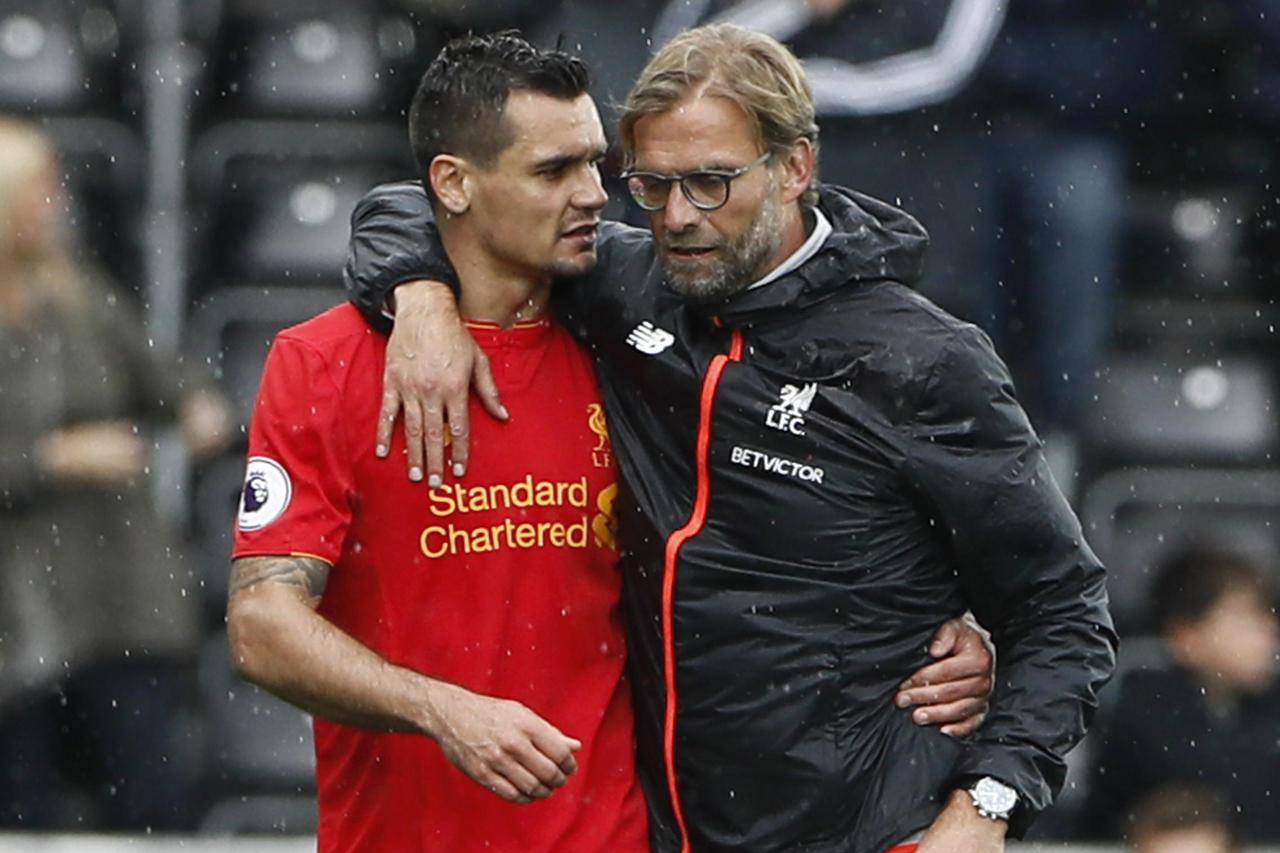 Britain Soccer Football - Swansea City v Liverpool - Premier League - Liberty Stadium - 1/10/16 Liverpool manager Juergen Klopp celebrates with Dejan Lovren at the end of the match  Reuters / Stefan Wermuth Livepic EDITORIAL USE ONLY.