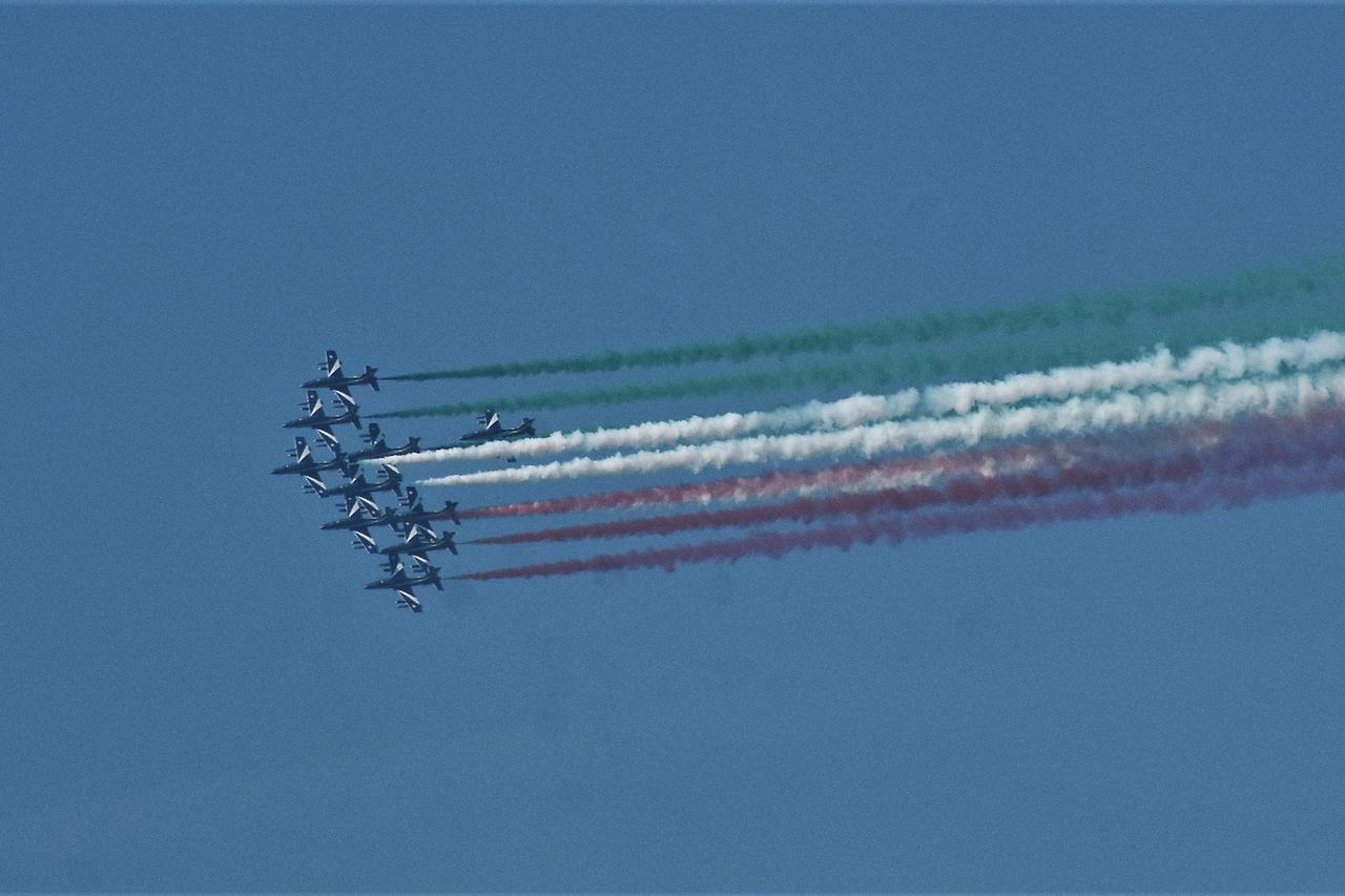 Milan,Italy Frecce Tricolori flyover at Palazzo Pirelli and Palazzo Lombardia conference presentation event
