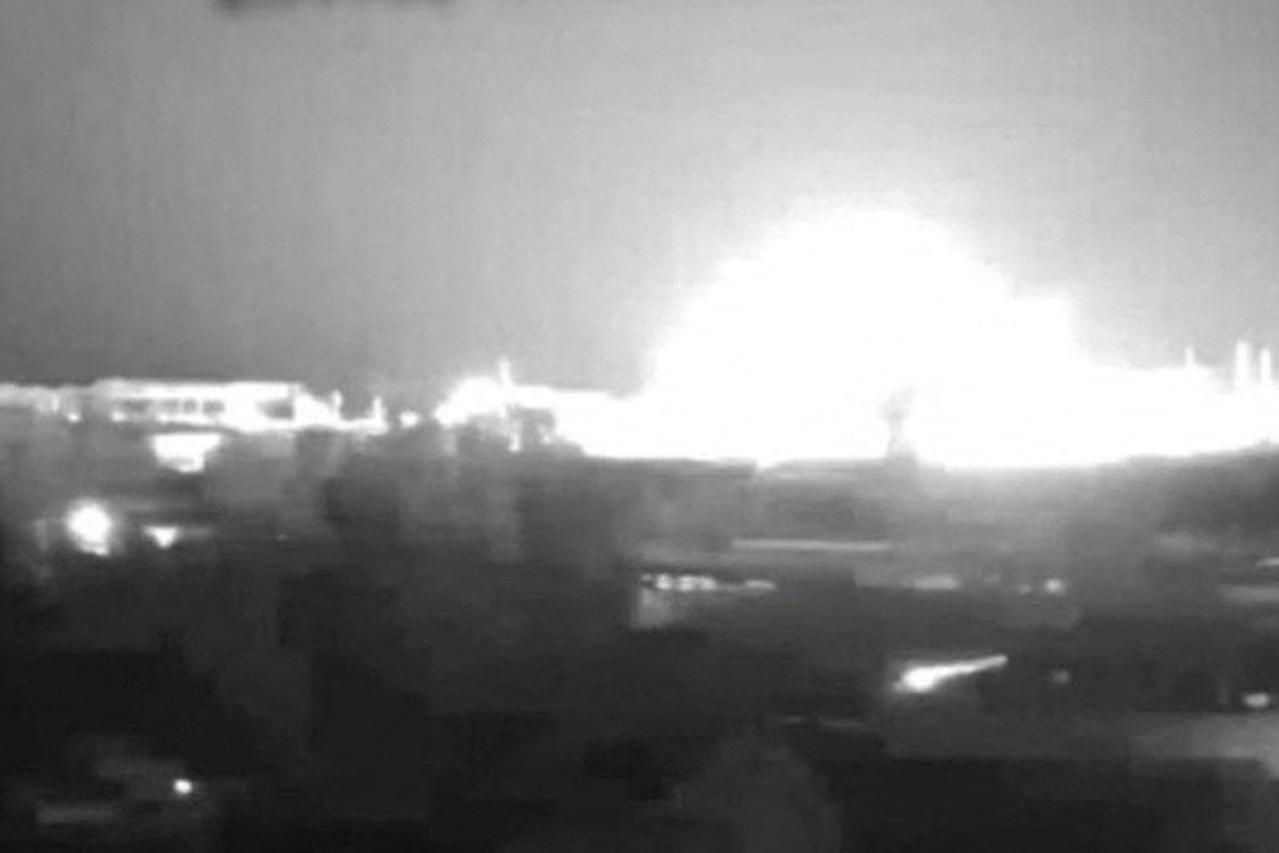 View from a CCTV camera shows a moment of a Russian military strike at a compound of the Pivdennoukrainsk Nuclear Power Plant in Yuzhnoukrainsk