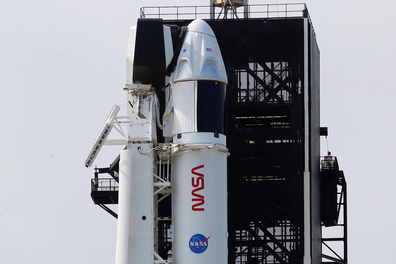 A SpaceX Falcon 9 rocket and Crew Dragon capsule is readied for launch in Cape Canaveral