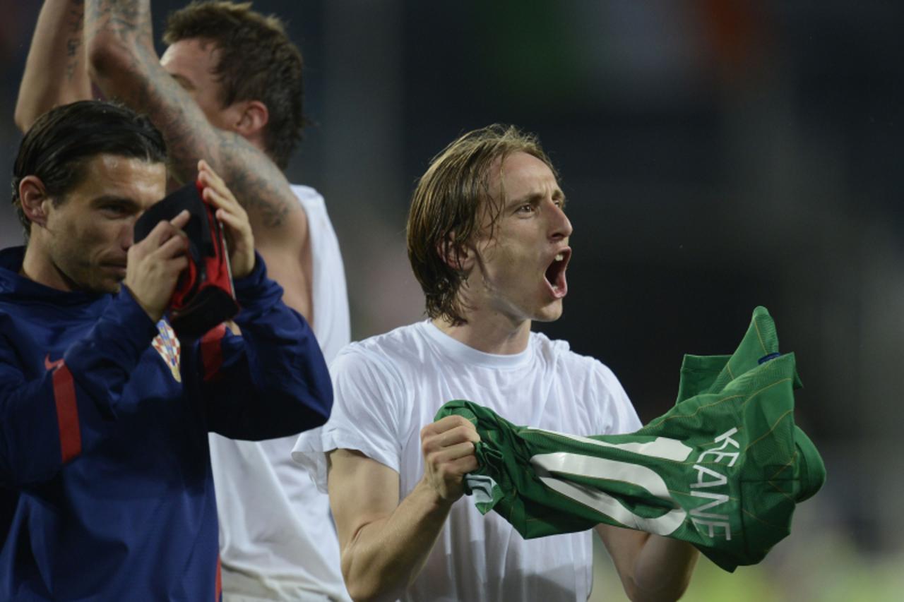 'Croatian midfielder Luka Modric celebrates at the end of the Euro 2012 championships football match Republic of Ireland vs Croatia on June 10, 2012 at the Municipal Stadium in Poznan. Croatia won 3 t