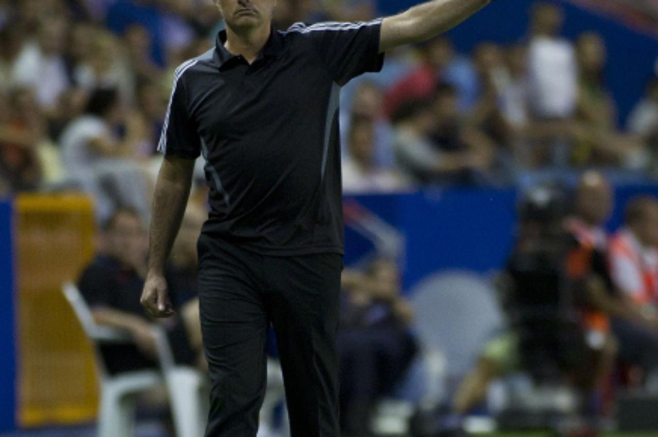 \'Real Madrid\'s Portuguese coach Jose Mourinho gestures during the Spanish league football match Levante vs Real Madrid on September 18, 2011 at the Ciudad de Valencia Stadium in Valencia. AFP PHOTO 