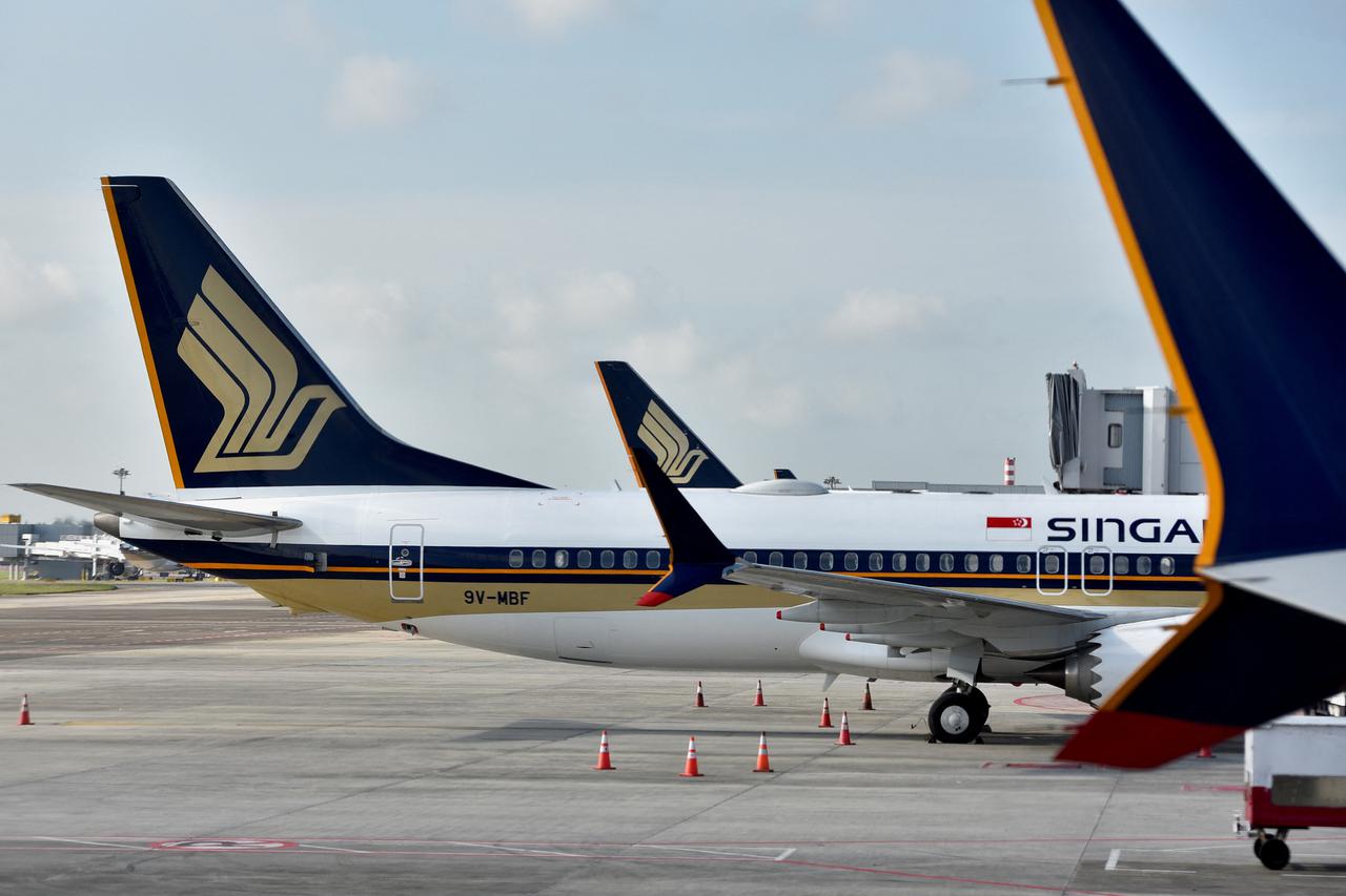 FILE PHOTO: Singapore Airlines planes sit on the tarmac at Changi Airport in Singapore