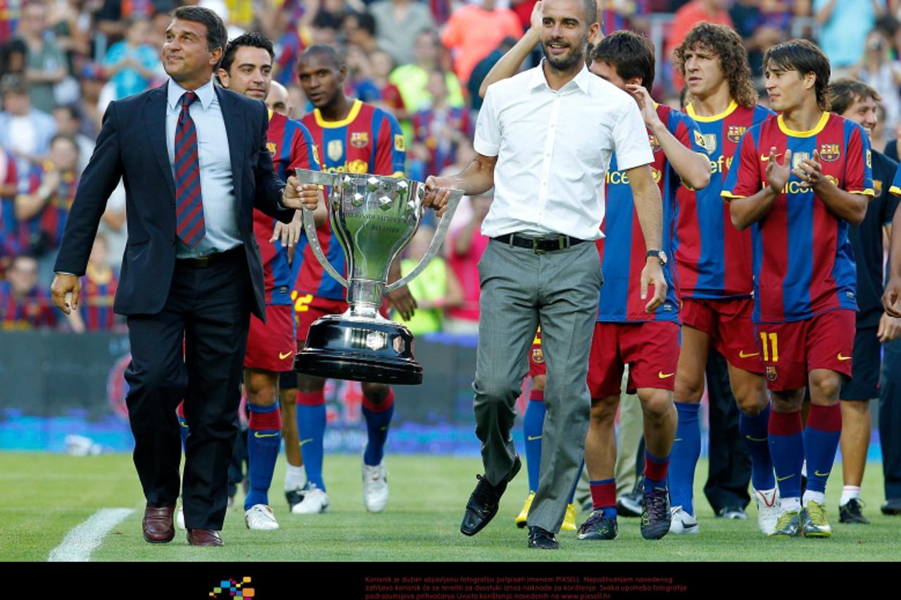 'FC Barcelona\'s coach Pep Guardiola and the ex President Joan Laporta with the La Liga Champions 2009-2010 trophy during Joan Gamper Trophy. August 25,2010. (Foto © nph/Acero) *** Local Caption *** F