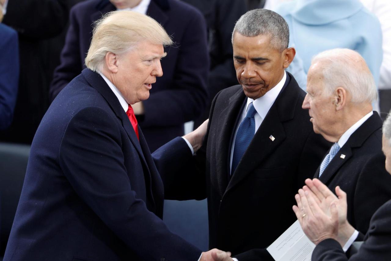 FILE PHOTO: U.S. President Donald Trump greets former Vice President Joe Biden and former President Barack Obama after being sworn in as president of the United States at U.S. Capitol in Washington
