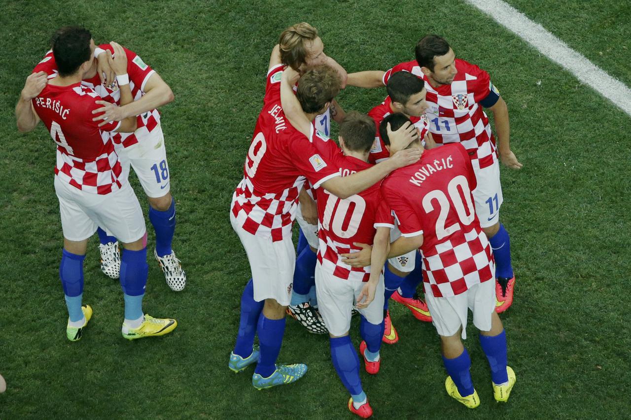 Croatia's players celebrate an own goal by Brazil's Marcelo during their 2014 World Cup opening match at the Corinthians arena in Sao Paulo June 12, 2014.