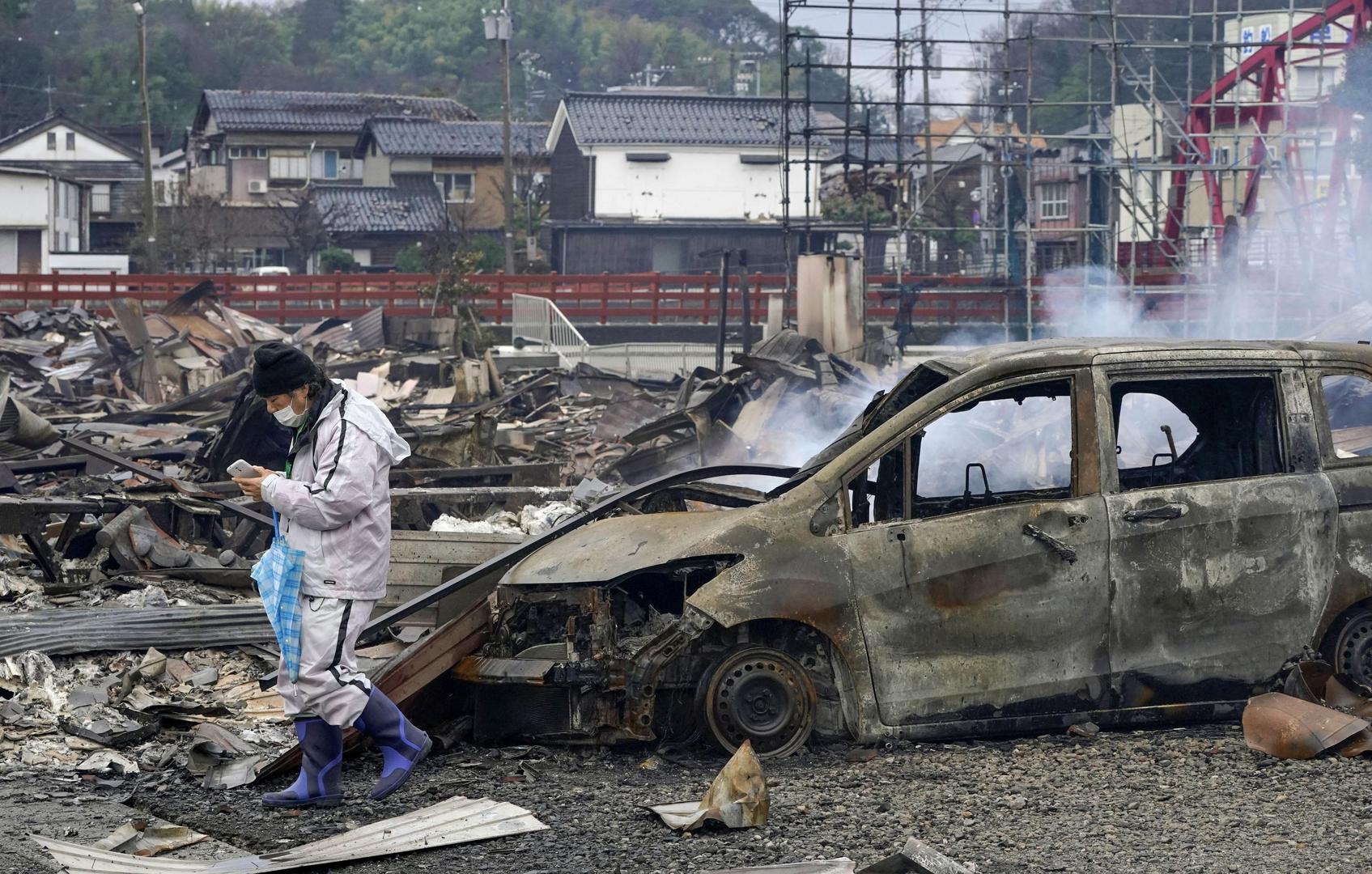 A local resident walks at a burnt down residential and commercial area following an earthquake in Wajima, Ishikawa prefecture, Japan January 3, 2024. Kyodo/via REUTERS   ATTENTION EDITORS - THIS IMAGE HAS BEEN SUPPLIED BY A THIRD PARTY. MANDATORY CREDIT. JAPAN OUT. NO COMMERCIAL OR EDITORIAL SALES IN JAPAN. Photo: KYODO/REUTERS
