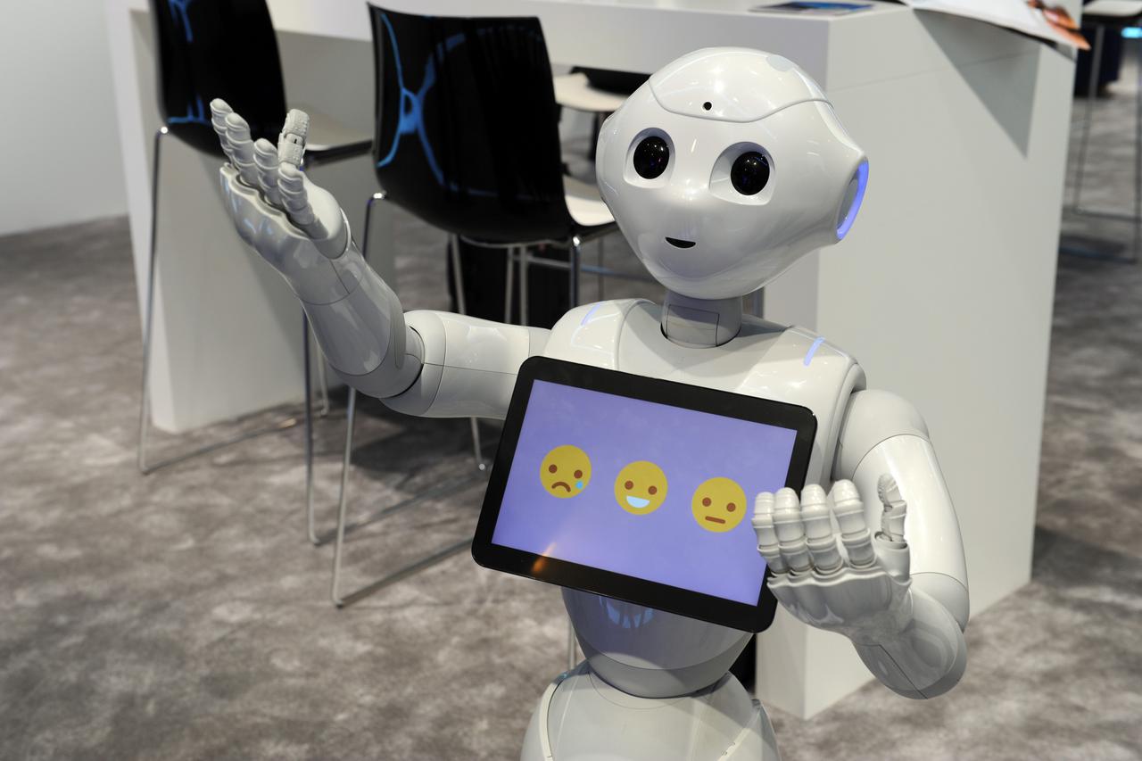 The robot 'Pepper' from Japanese company Softbank communicates with visitors at the Mobile World Congress in Barcelona,?Spain, 25 February 2016. The French Softbank subsidiary Aldebaran Robotics have sold 10,000 'Pepper' robots in Japan since June.?Photo: