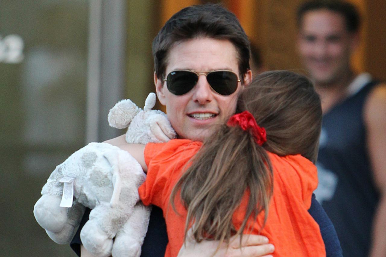 'This Tuesday July 17, 2012 photo shows actor Tom Cruise and daughter Suri Cruise leaving Chelsea Piers in New York. (AP Photo/ Donald Traill)'