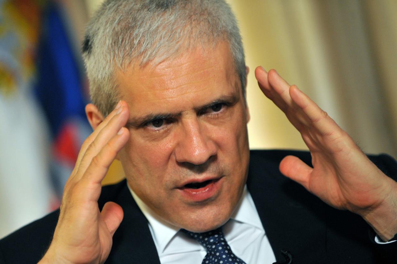 'Serbian President Boris Tadic gestures during an interview in Belgrade on June 1, 2011, a day after former Bosnian Serb army chief Ratko Mladic was transfered to The Hague to appear before a three-ju