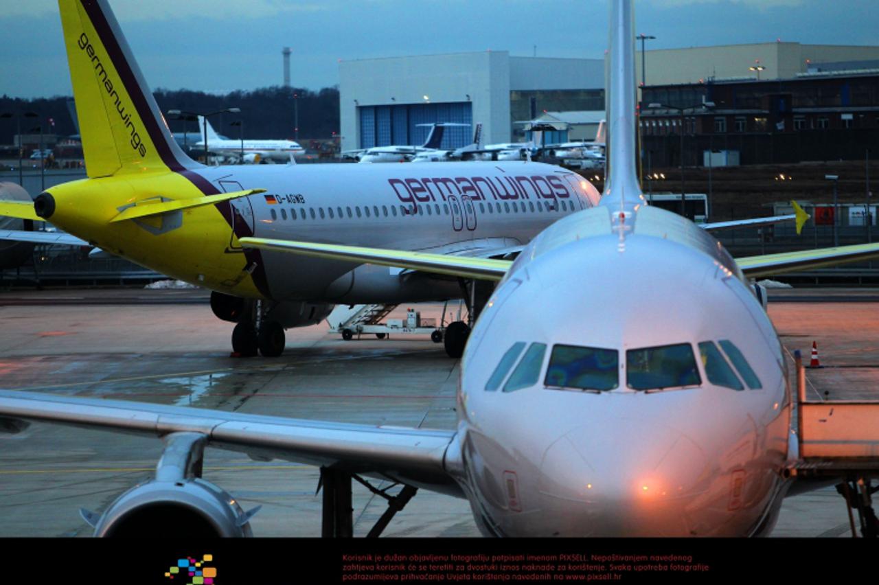 'Aeroplanes of low-cost airline Germanwings stand at the airfield of the airport in Cologne, Germany, 22 February 2010. Pilots' union Cockpit has followed through on their threat of almost completely
