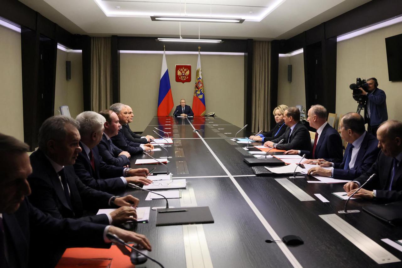 Russian President Vladimir Putin chairs a meeting with members of the Security Council in Moscow Region