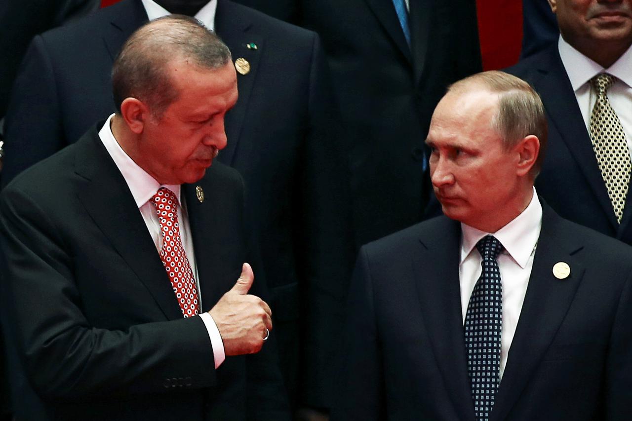 REFILE - ADDING FIRST NAME OF TURKEY'S PRESIDENT Russia's President Vladimir Putin interacts with Turkey's President Tayyip Erdogan as they pose for a group picture during the G20 Summit in Hangzhou, Zhejiang province, China September 4, 2016. REUTERS/Dam