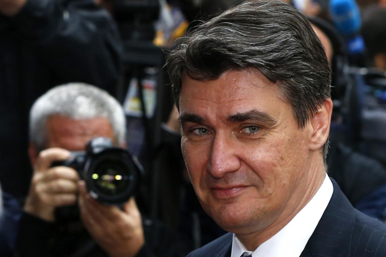 'Croatia's Prime Minister Zoran Milanovic arrives at a European Union leaders summit in Brussels June 27, 2013. European officials struck two significant deals on banking resolution and their long-te