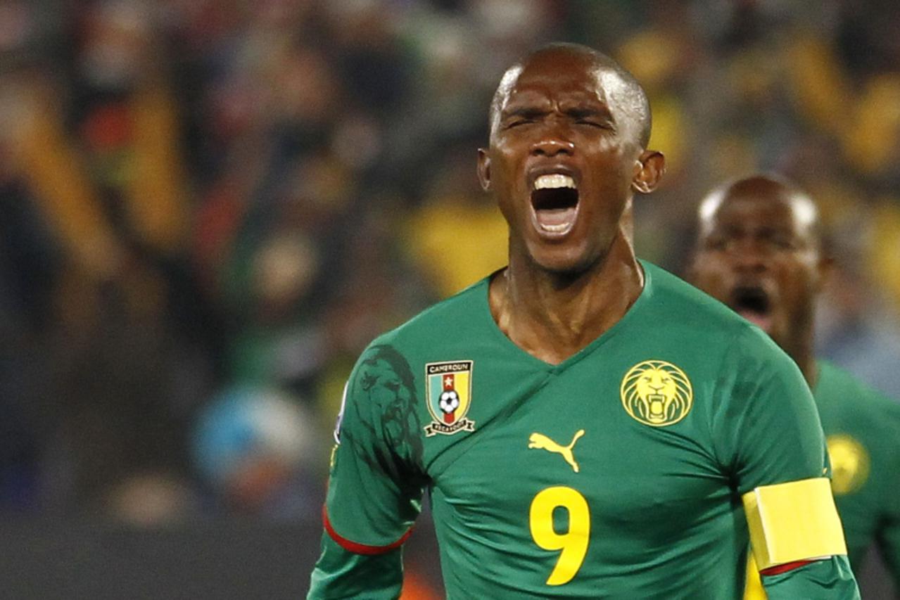 'Cameroon\'s striker Samuel Eto\'o celebrates after scoring  during their Group E first round 2010 World Cup football match on June 19, 2010 at Loftus Verfeld stadium in Tshwane/Pretoria. NO PUSH TO M