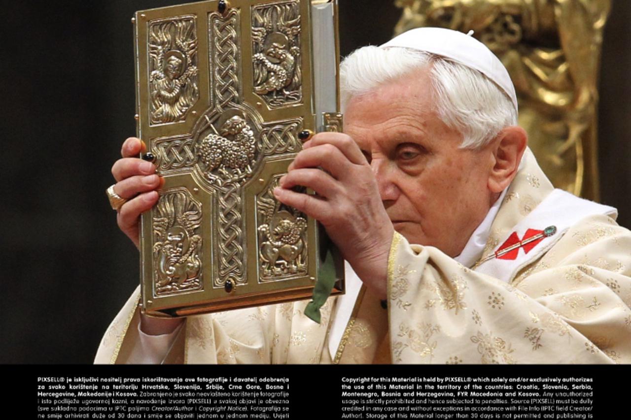 'Pope Benedit XVI. holds a bible during a mass in St. Peter's basilica at the Vatican on 19 February 2012. Pope Benedict XVI created 22 new cardinals at a ceremony on 18 February 2012. Photo: Karl-Jo