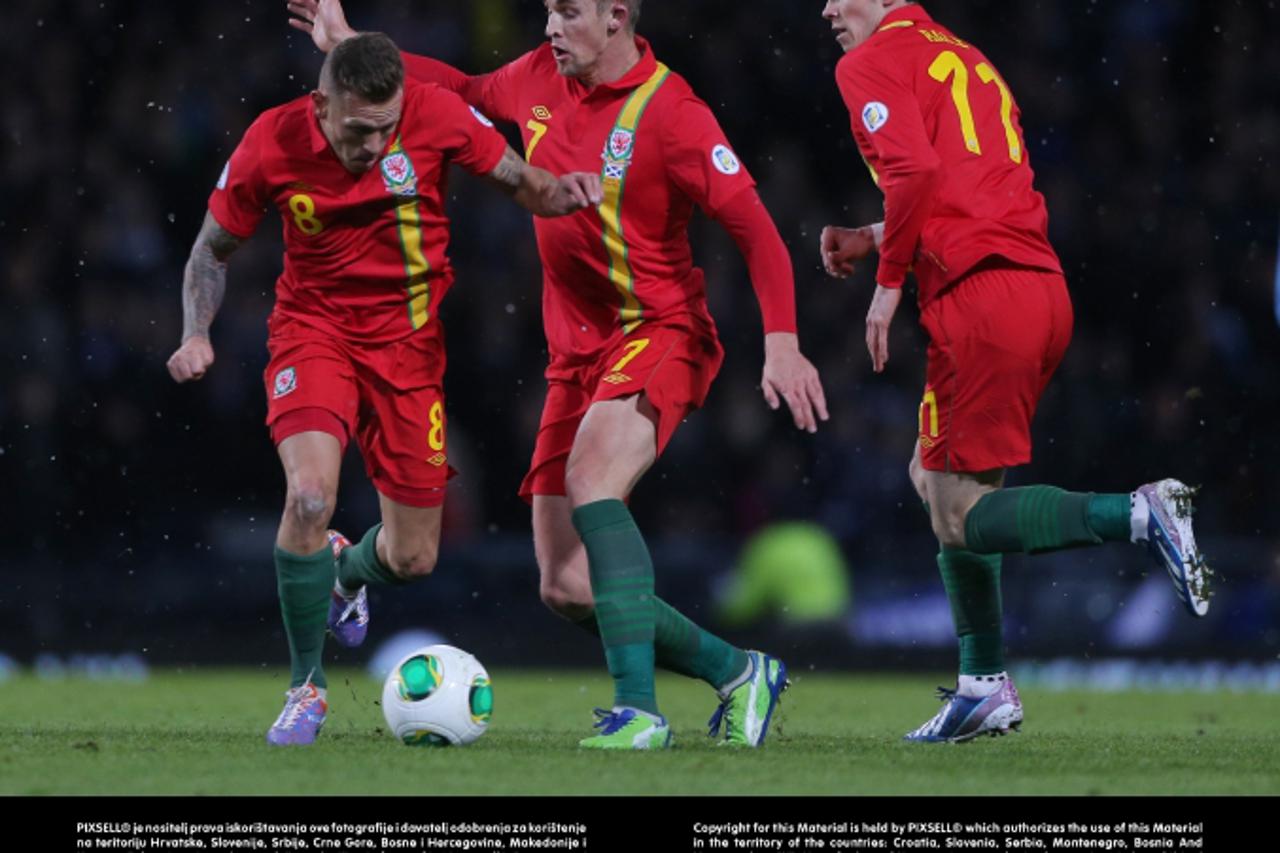 'Wales\'s Craig Bellamy (left) with team mates Jack Collison and Gareth Bale (right) during Scotland game in the 2014 World Cup Qualifier at Hampden Park, Glasgow.Photo: Press Association/PIXSELL'