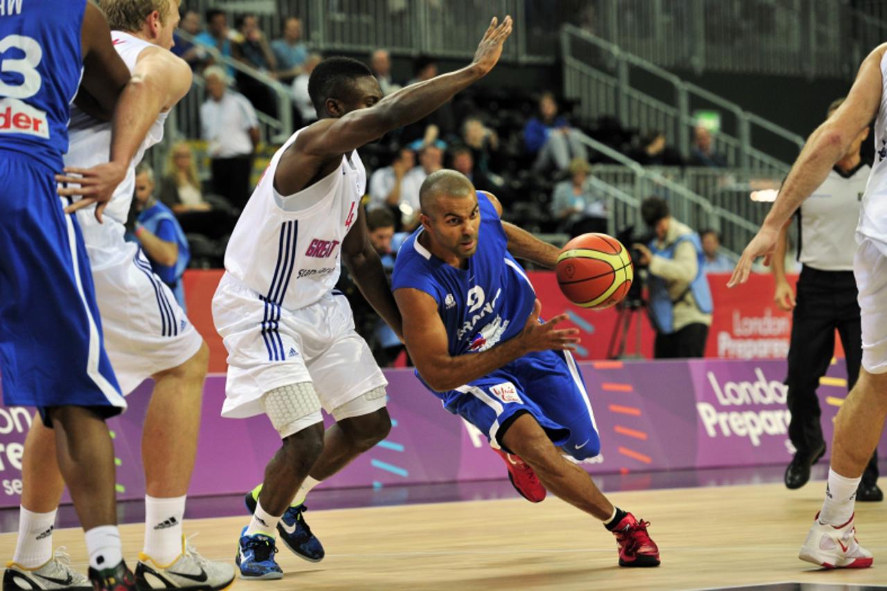 \'Tony Parker of France (R) vies with Ogo Adegboye of Great Britain (L) during the London International Basketball Invitational, part of the London Prepares series at the Olympic Park, Stratford in Lo