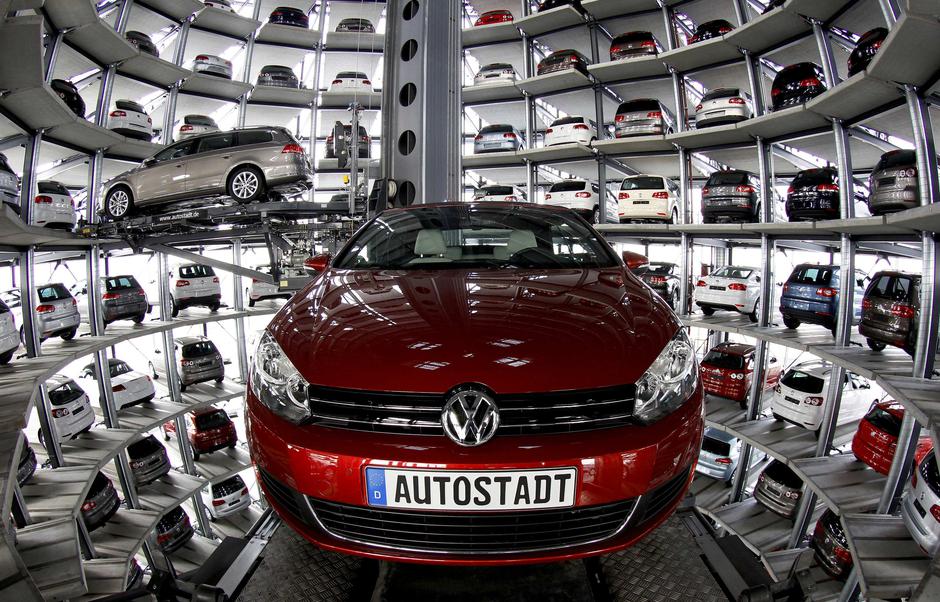 New Volkswagen models Golf Cabriolet and Passat are stored at the 'CarTowers' in the theme park 'Autostadt' next to the Volkswagen plant in Wolfsburg March 9, 2011. Volkswagen unveiled plans to cut 23,000 jobs in Germany to help achieve 3.7 billion euros 