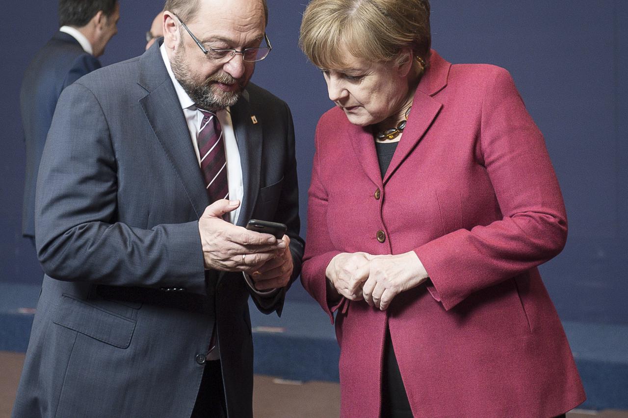 Martin Schulz , the president of the European Parliament (L) and German Federal Chancellor Angela Merkel   during family photo at the first day of EU leaders summit on migration at European Council headquarters in Brussels, Belgium on 17.03.2016 by Wiktor